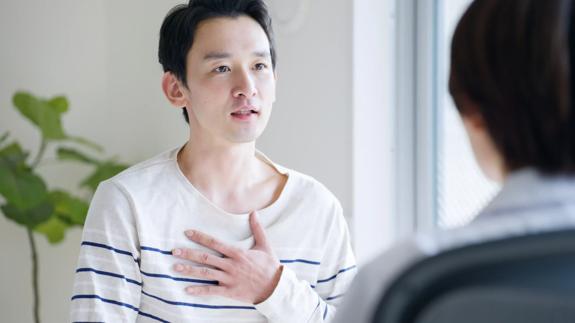 受診する男性